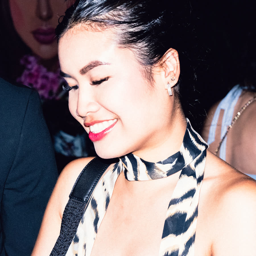 Model in a zebra-print halter look photographed candidly