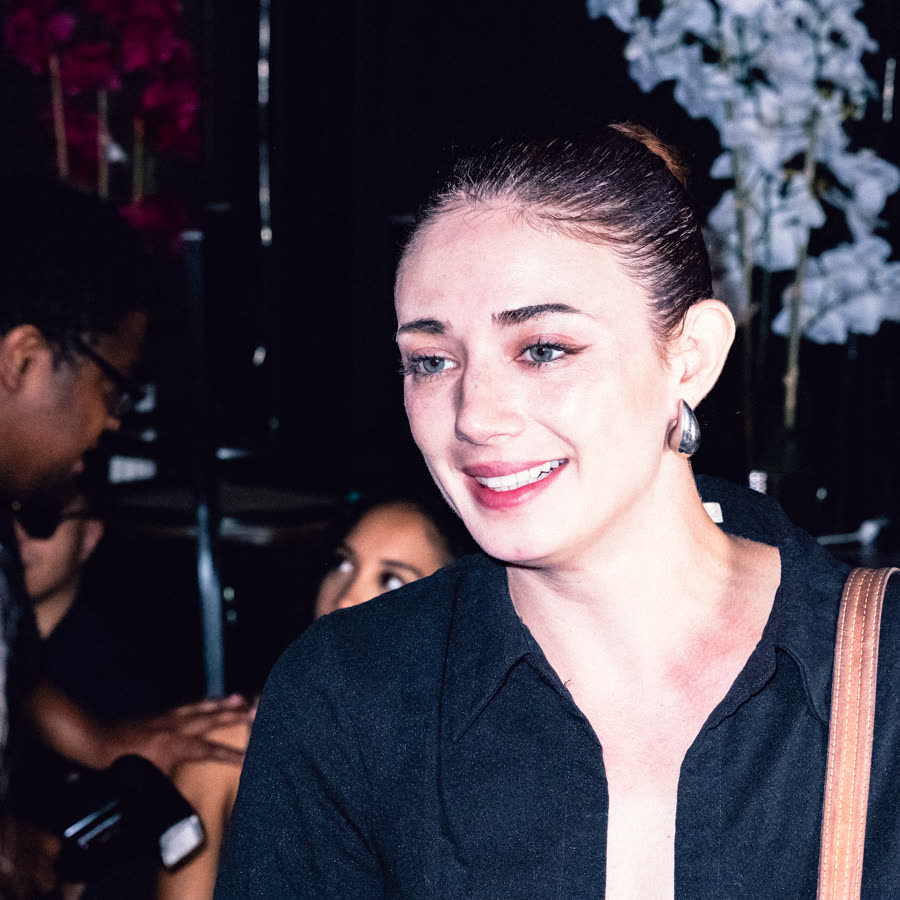 Model in a black tailored look photographed at an event